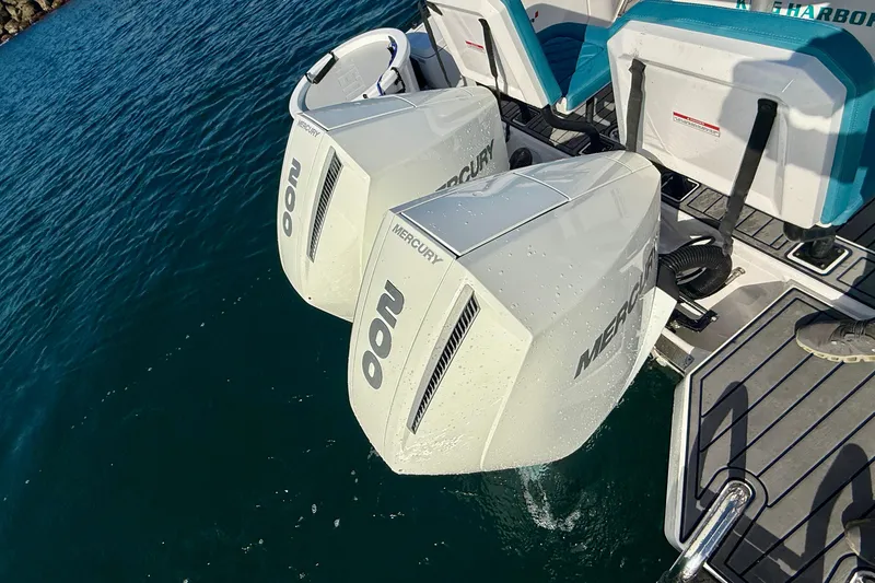 Slide: The Image of Twin Mercury outboard engines on a 2021 Axopar Brabus 28 Cabin boat. - 24