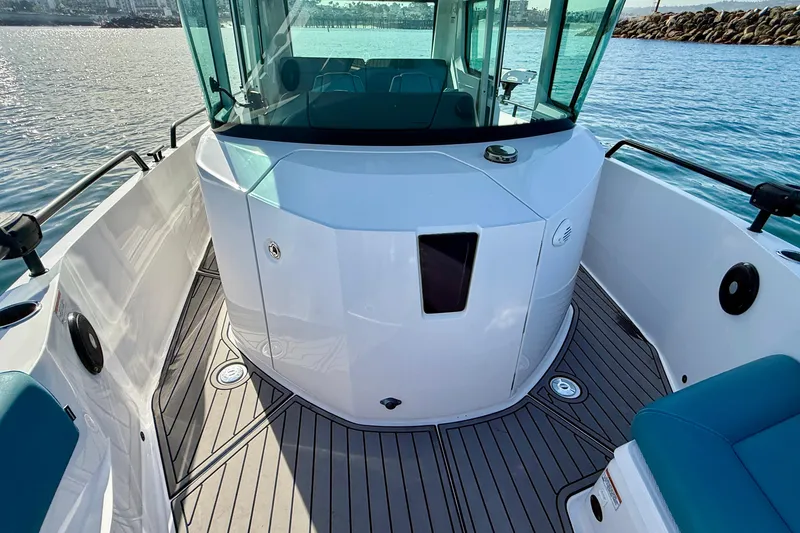 Slide: The Image of 2021 Axopar Brabus 28 Cabin boat deck with sleek design and modern features. - 25