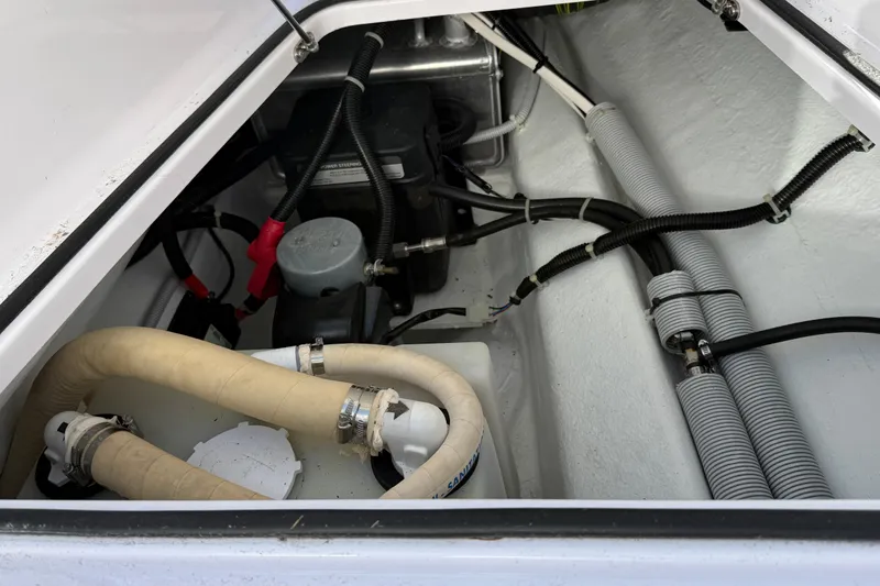 Slide: The Image of Engine compartment of 2021 Axopar Brabus 28 Cabin, showcasing hoses and wiring. - 27