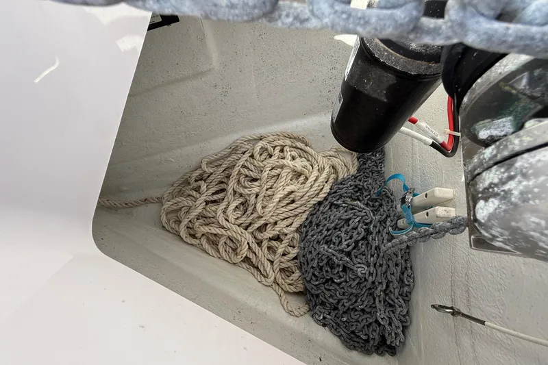 Slide: The Image of Rope and chain storage in 2021 Axopar Brabus 28 Cabin boat compartment. - 29