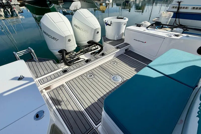Slide: The Image of 2021 Axopar Brabus 28 Cabin boat with Mercury engines, docked at marina. - 32