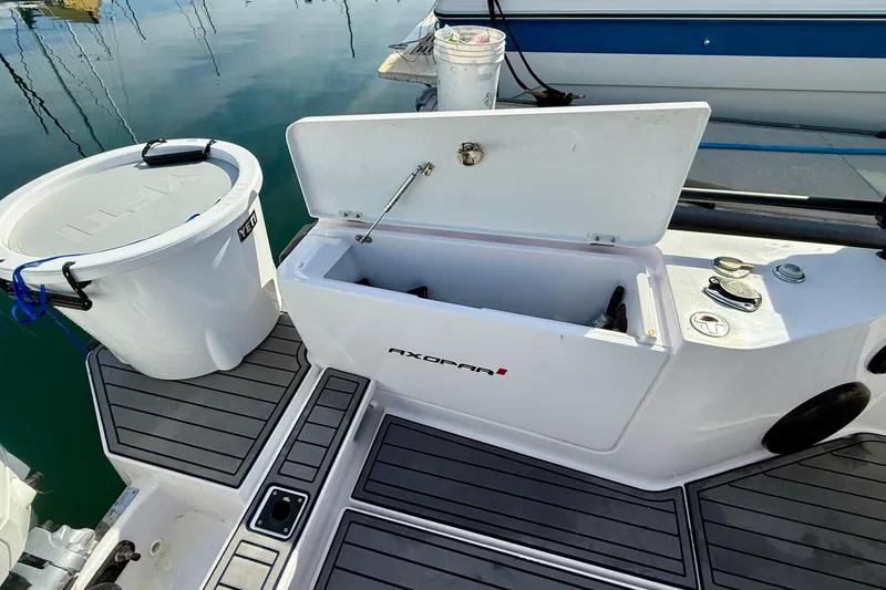 Slide: The Image of Open storage compartment on 2021 Axopar Brabus 28 Cabin boat deck. - 33