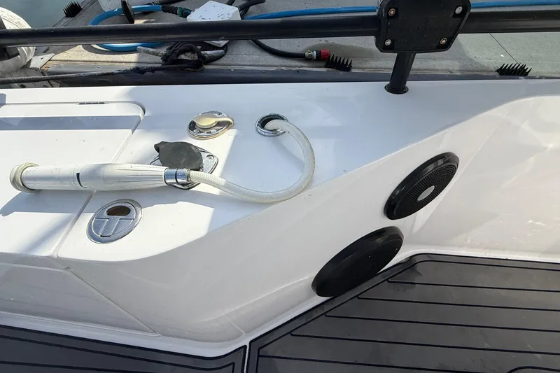 Slide: The Image of 2021 Axopar Brabus 28 Cabin deck with hose and fittings. - 34