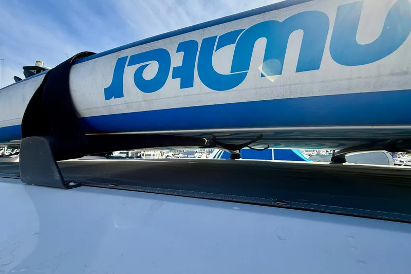 Slide: The Image of Roof-mounted equipment on a 2021 Axopar Brabus 28 Cabin boat, featuring a blue and white design. - 36