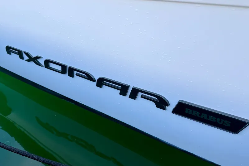Slide: The Image of Close-up of 2021 Axopar Brabus 28 Cabin logo on boat hull. - 40