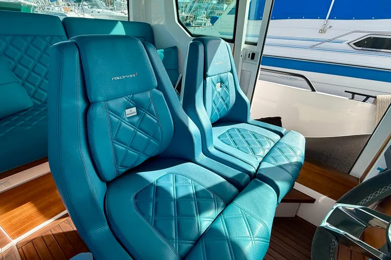 Slide: The Image of Luxurious blue interior seating of 2021 Axopar Brabus 28 Cabin boat. - 43