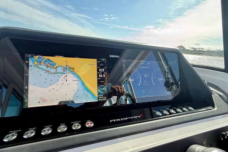 Slide: The Image of Dashboard of 2021 Axopar Brabus 28 Cabin with navigation and control displays. - 44