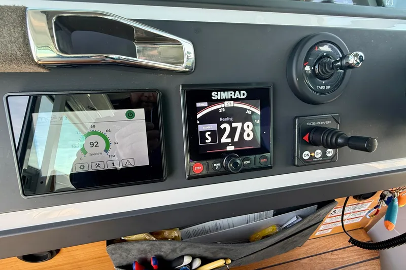 Slide: The Image of Control panel of 2021 Axopar Brabus 28 Cabin with navigation and speed displays. - 46