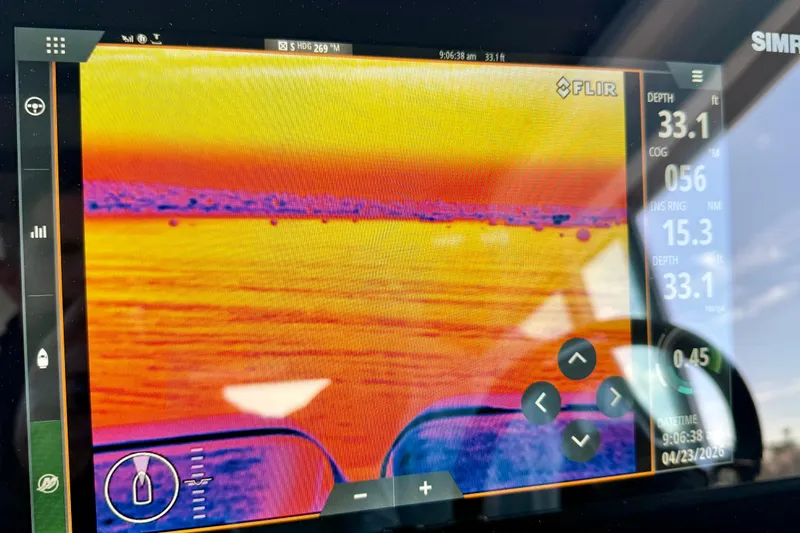 Slide: The Image of Thermal imaging display on 2021 Axopar Brabus 28 Cabin boat, showing depth and navigation data. - 47