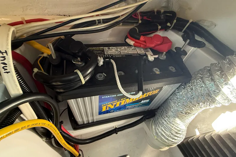 Slide: The Image of Battery compartment of 2021 Axopar Brabus 28 Cabin with wiring and ventilation. - 59