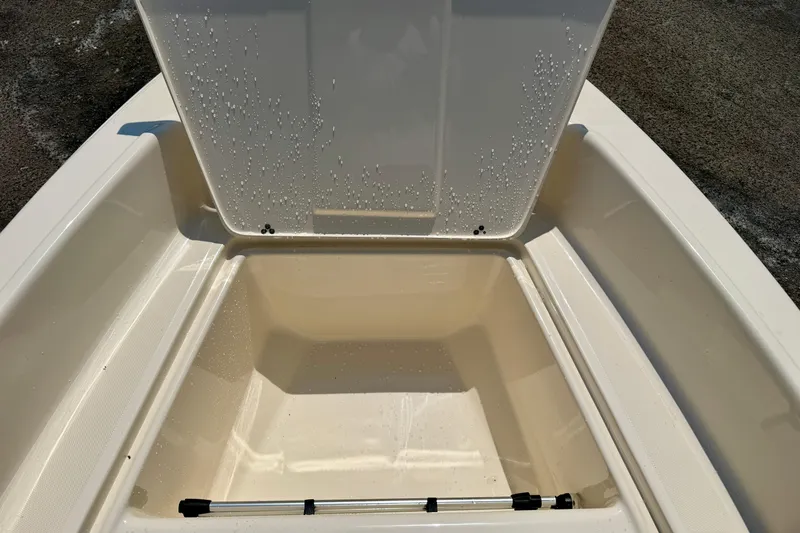 Slide: The Image of Open storage compartment of a 2017 Scout 175 Sportfish boat, showing interior details. - 10
