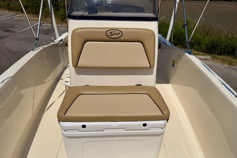 Slide: The Image of 2017 Scout 175 Sportfish boat interior with tan cushioned seating. - 12