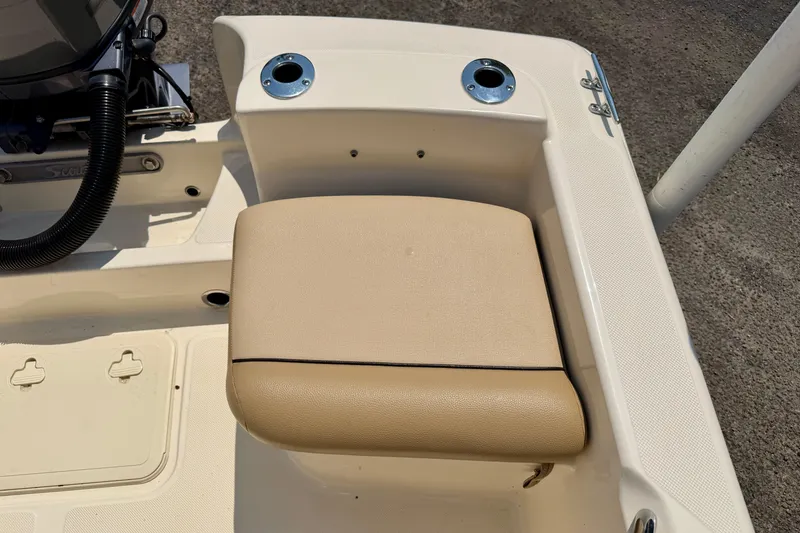 Slide: The Image of 2017 Scout 175 Sportfish boat seat with beige cushion and cup holders. - 20