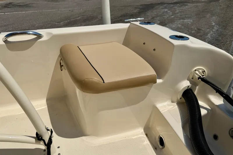 Slide: The Image of 2017 Scout 175 Sportfish boat interior with beige cushioned seat and cup holders. - 23