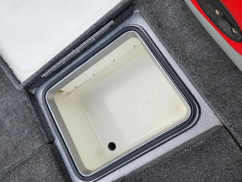 Slide: The Image of Open storage compartment in 2011 Ranger Z520 boat. - 15