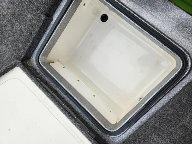 Slide: The Image of Interior of a 2011 Ranger Z520 boat storage compartment. - 16
