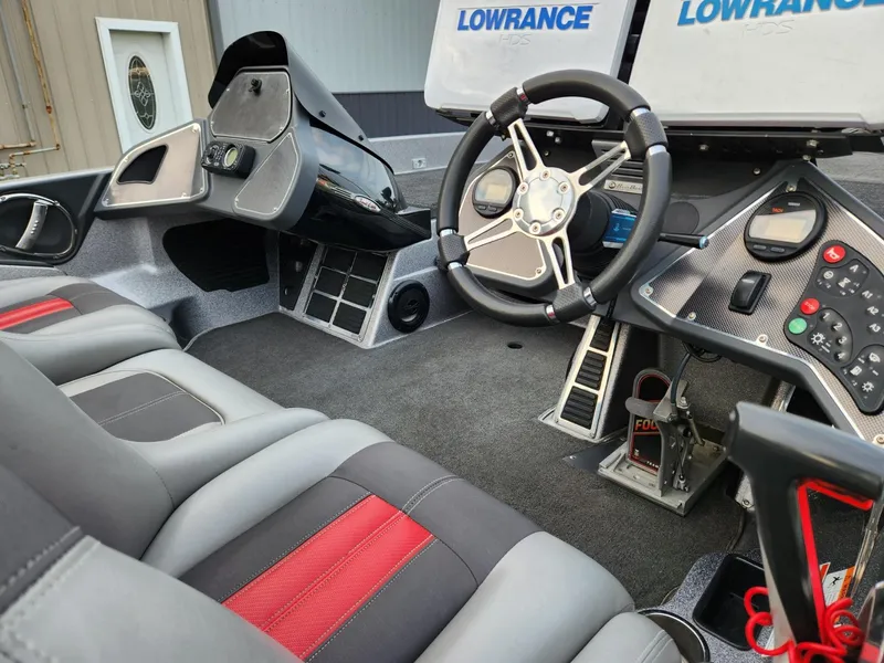 Slide: The Image of Interior of a 2011 Ranger Z520 boat with modern equipment. - 6
