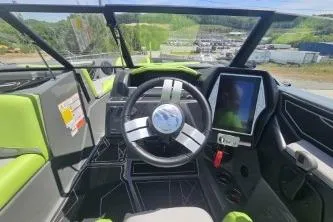 The Image of 2022 Tigé Z3 boat cockpit with modern steering and digital display. - 1
