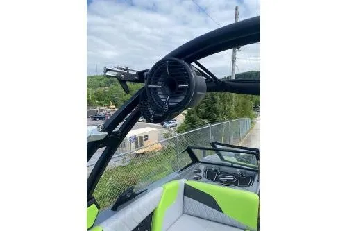 Slide: The Image of 2022 Tigé Z3 boat interior with green seating and speaker system. - 10