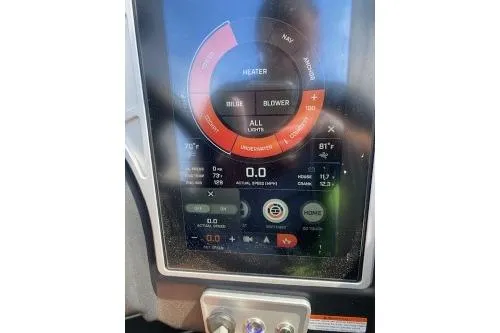 Slide: The Image of 2022 Tigé Z3 boat dashboard display with control settings and indicators. - 12