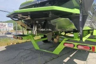 Slide: The Image of 2022 Tigé Z3 boat on trailer, showcasing rear design and propeller system. - 3