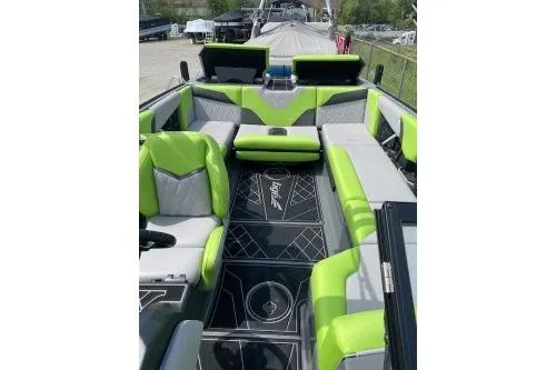 Slide: The Image of 2022 Tigé Z3 boat interior with green and gray seating, modern design. - 7