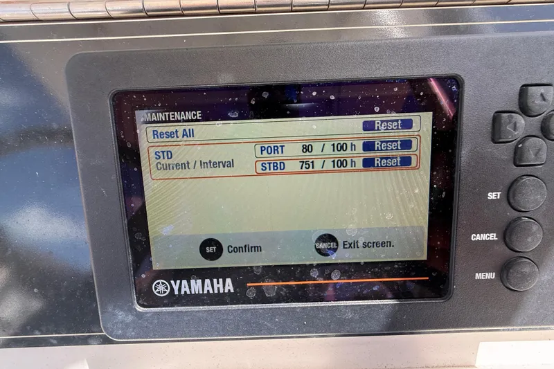 Slide: The Image of Yamaha maintenance display on 2006 SeaVee 290B boat, showing engine hours and reset options. - 13