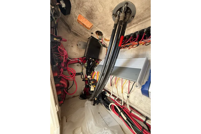 Slide: The Image of Electrical wiring and components inside a 2006 SeaVee 290B boat. - 21
