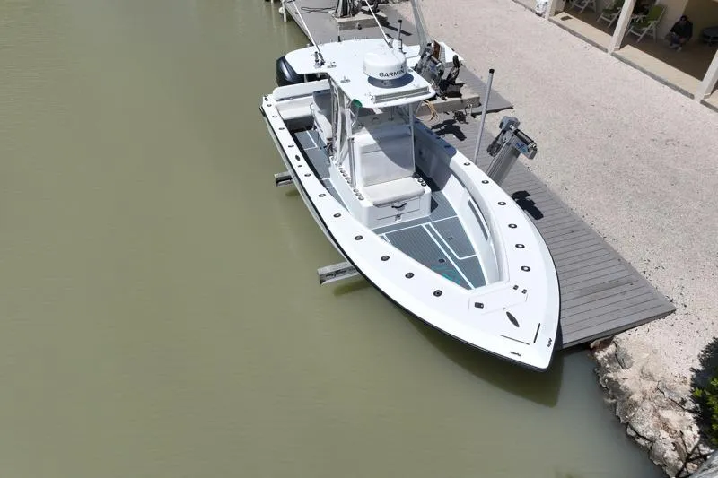 Slide: The Image of 2006 SeaVee 290B boat docked on calm water, aerial view. - 30