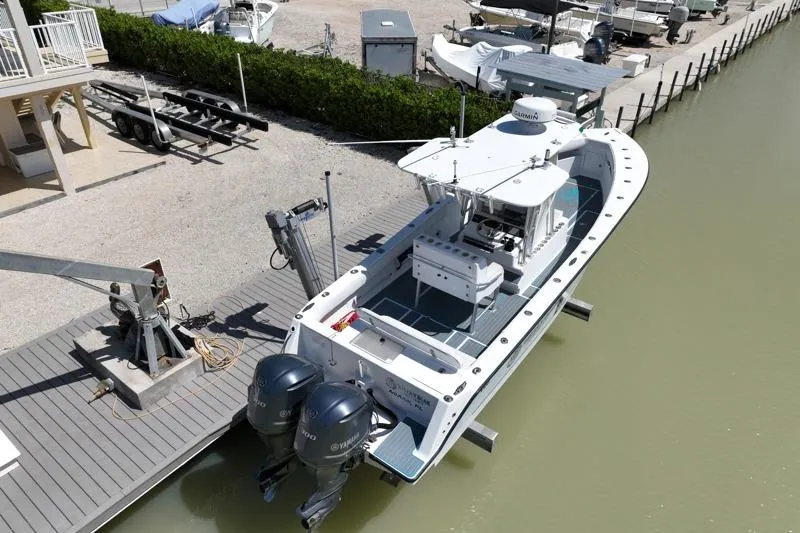 Slide: The Image of 2006 SeaVee 290B boat docked with dual outboard engines, aerial view. - 35