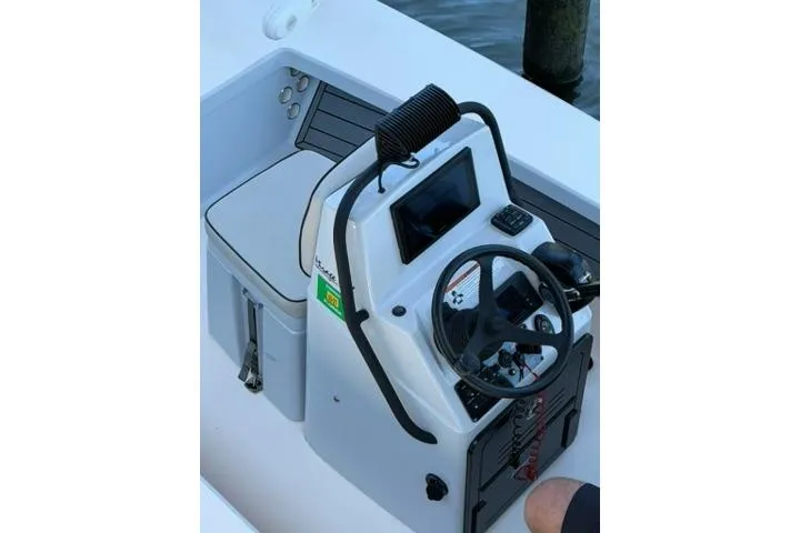 Slide: The Image of 2020 Maverick Mirage 17 HPX-V boat console with steering wheel and navigation display. - 10