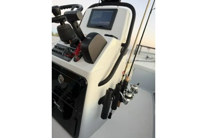 Slide: The Image of 2020 Maverick Mirage 17 HPX-V boat console with fishing rods and navigation equipment. - 11