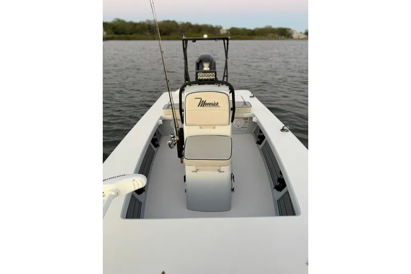 Slide: The Image of 2020 Maverick Mirage 17 HPX-V boat on calm water, showcasing interior and seating. - 12