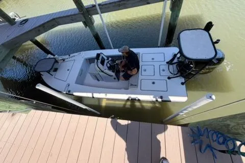 Slide: The Image of 2020 Maverick Mirage 17 HPX-V boat docked in a marina, viewed from above. - 3