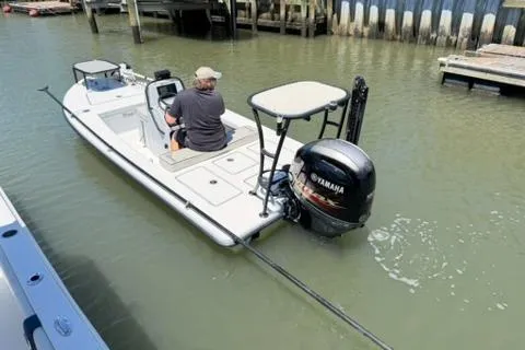 Slide: The Image of 2020 Maverick Mirage 17 HPX-V boat with Yamaha outboard motor in a marina setting. - 4
