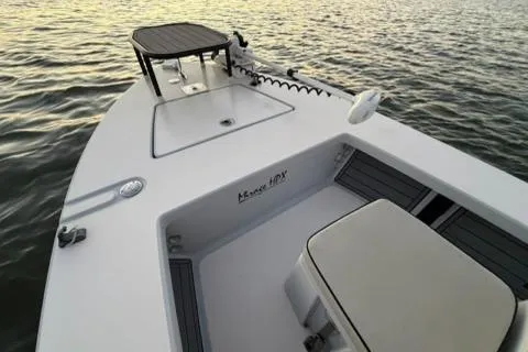 Slide: The Image of 2020 Maverick Mirage 17 HPX-V boat on water, featuring sleek deck design. - 7