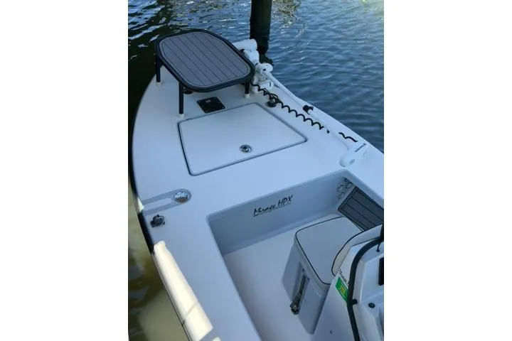 Slide: The Image of 2020 Maverick Mirage 17 HPX-V boat deck with seating and storage compartments. - 9