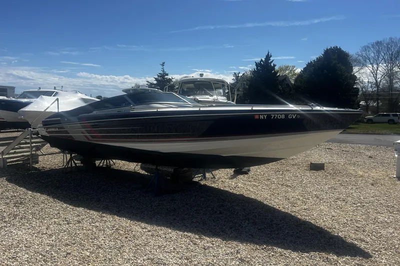 The Image of 2017 Formula 292 FASTech speedboat displayed outdoors on gravel lot. - 0