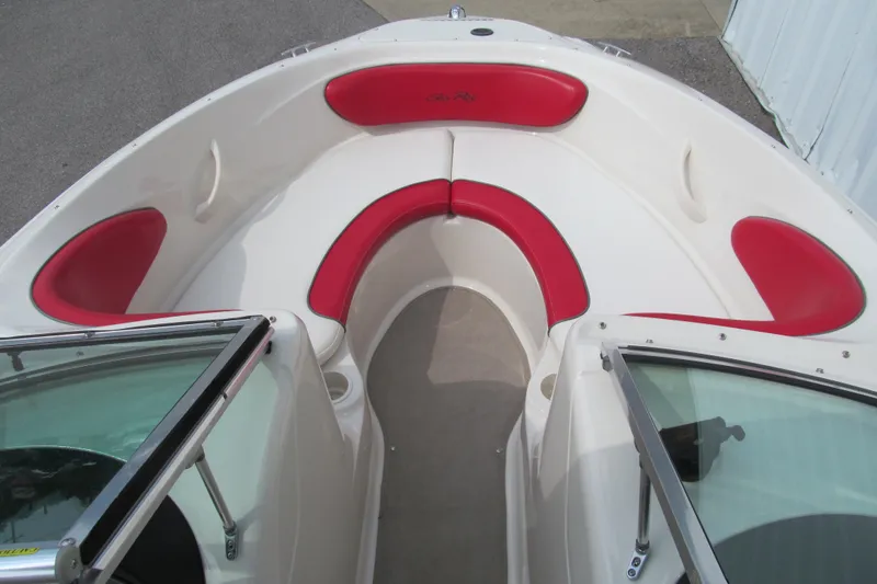 Slide: The Image of 2006 Sea Ray 205 Sport boat interior with red and white seating. - 9