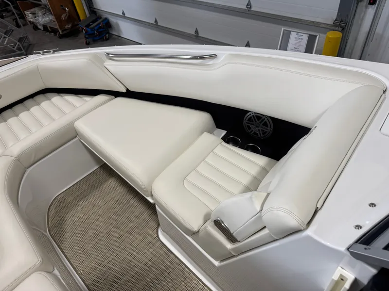 Slide: The Image of Interior of a 2016 Cobalt R7 boat with white leather seating. - 42