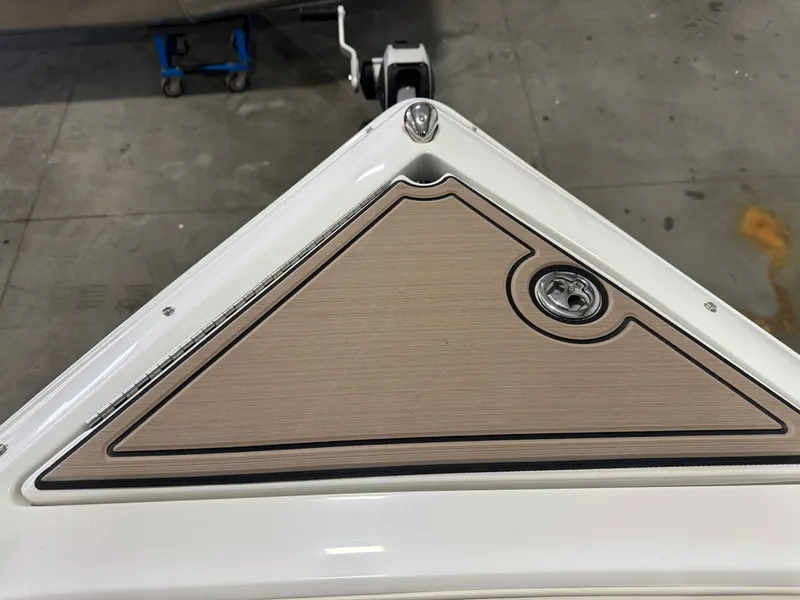 Slide: The Image of Cobalt R7 2016 boat deck with wood finish and metal latch. - 44