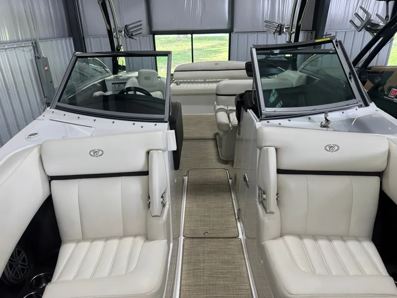 Slide: The Image of Interior of a 2016 Cobalt R7 boat with white leather seats. - 45