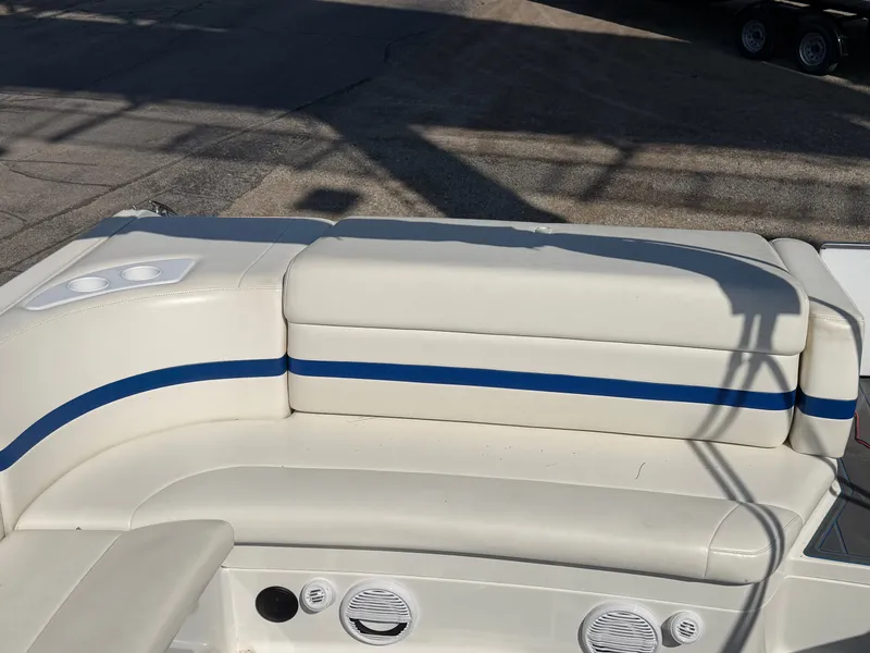Slide: The Image of 2002 Formula 330 Sun Sport boat seating with blue accents. - 12