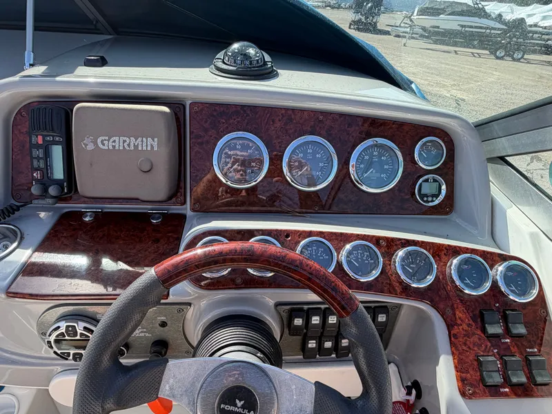 Slide: The Image of Dashboard of a 2002 Formula 330 Sun Sport boat with Garmin navigation. - 14