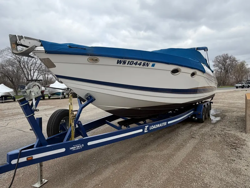 Slide: The Image of 2002 Formula 330 Sun Sport boat on a trailer. - 2