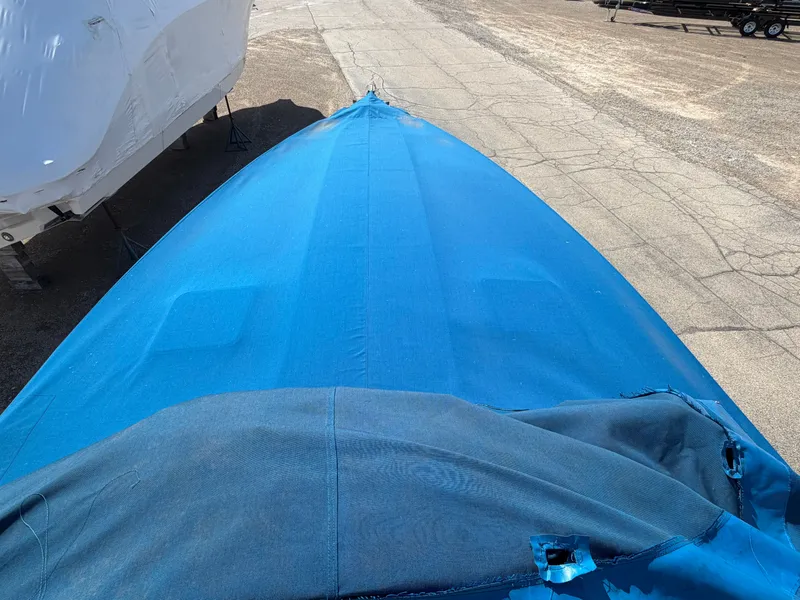 Slide: The Image of Covered boat, Formula 330 Sun Sport, 2002 model, parked outdoors. - 23