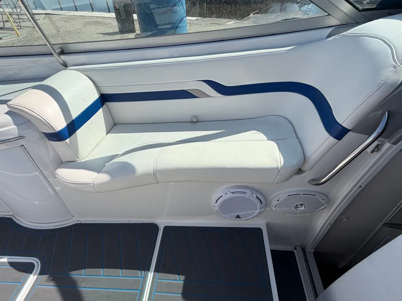 Slide: The Image of Interior of a 2002 Formula 330 Sun Sport with white and blue seating. - 24