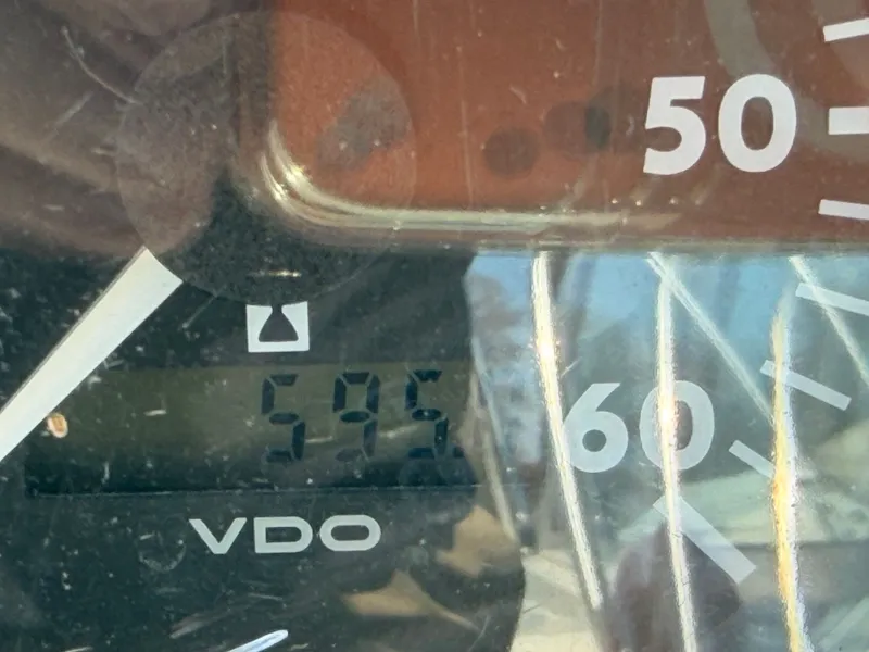 Slide: The Image of Close-up of a VDO tachometer reading 595 hours. - 29