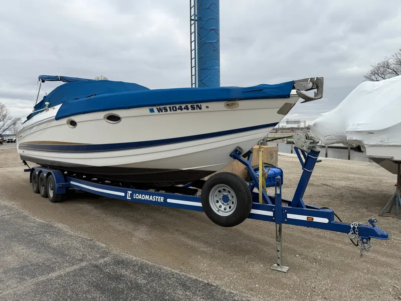 Slide: The Image of 2002 Formula 330 Sun Sport boat on trailer, blue and white. - 3