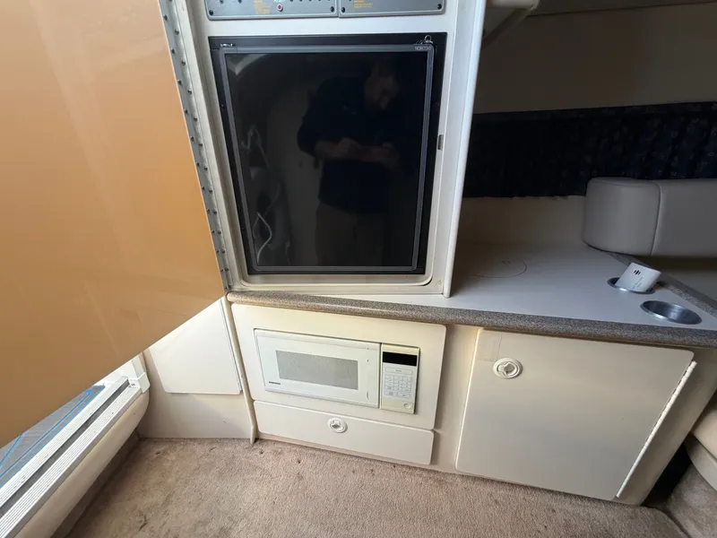 Slide: The Image of Interior of a 2002 Formula 330 Sun Sport with fridge and microwave. - 39